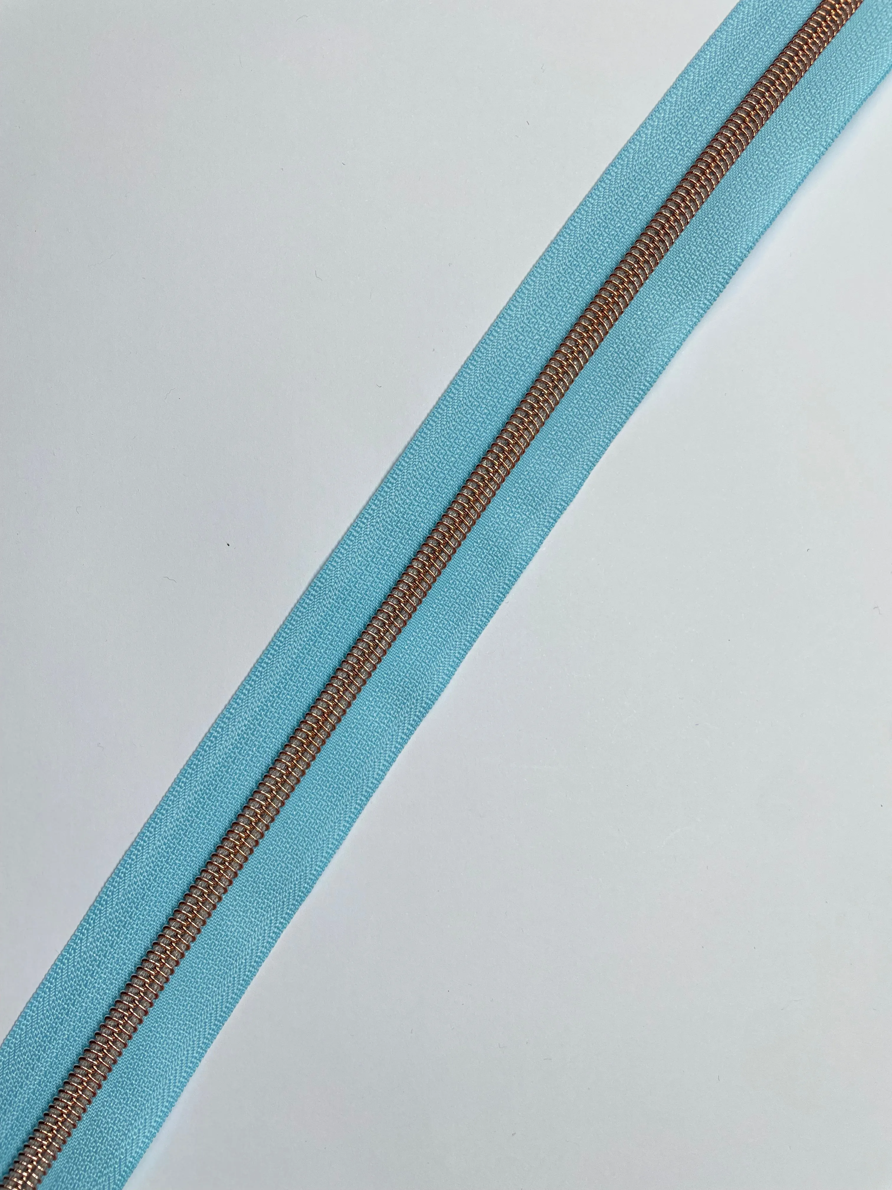No5 Rose Gold Teeth Nylon Zips Sold in Packs of 1 1/2 metre lengths